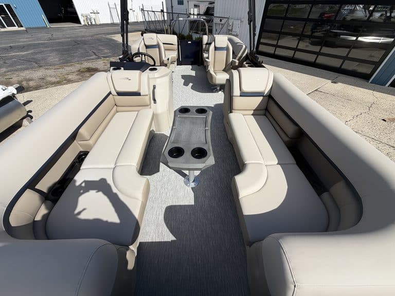 Bennington 21 SSR pontoon boat with beige seating and center console.