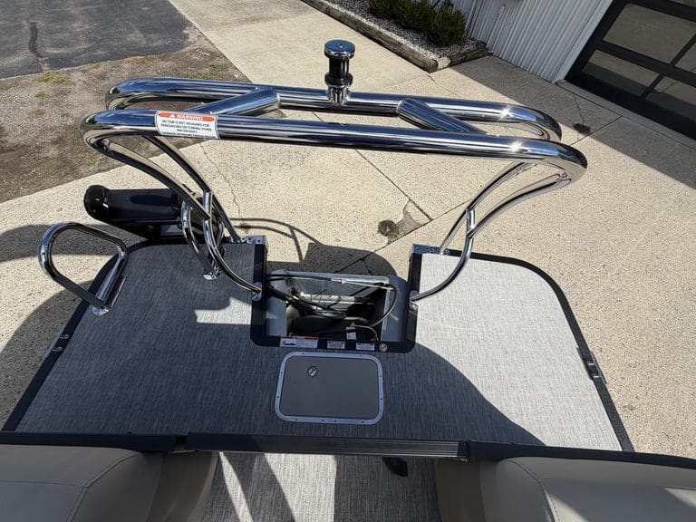 Golf cart with safety rail and flat surface for equipment or passengers.