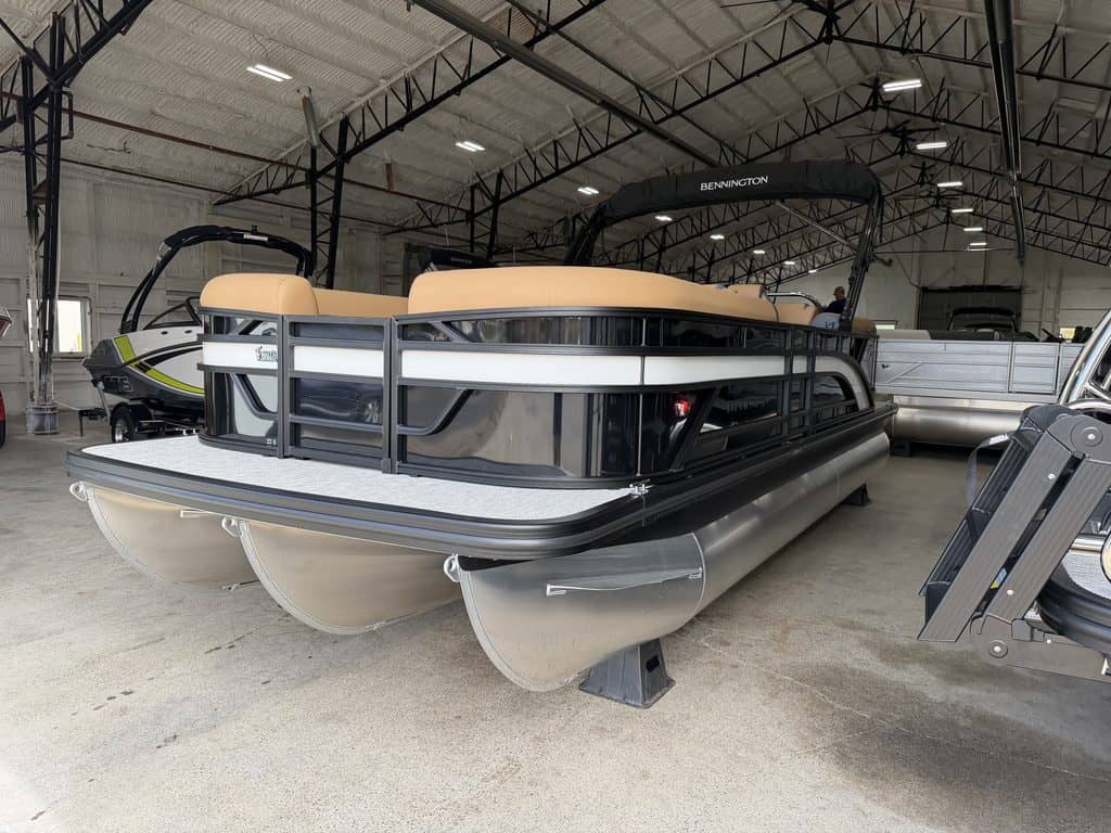 Bennington 22 SSR pontoon boat inside Hall's Sport Center.