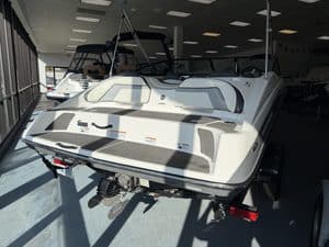White Yamaha Jet SX192 boat displayed indoors at Hall's Sport Center.