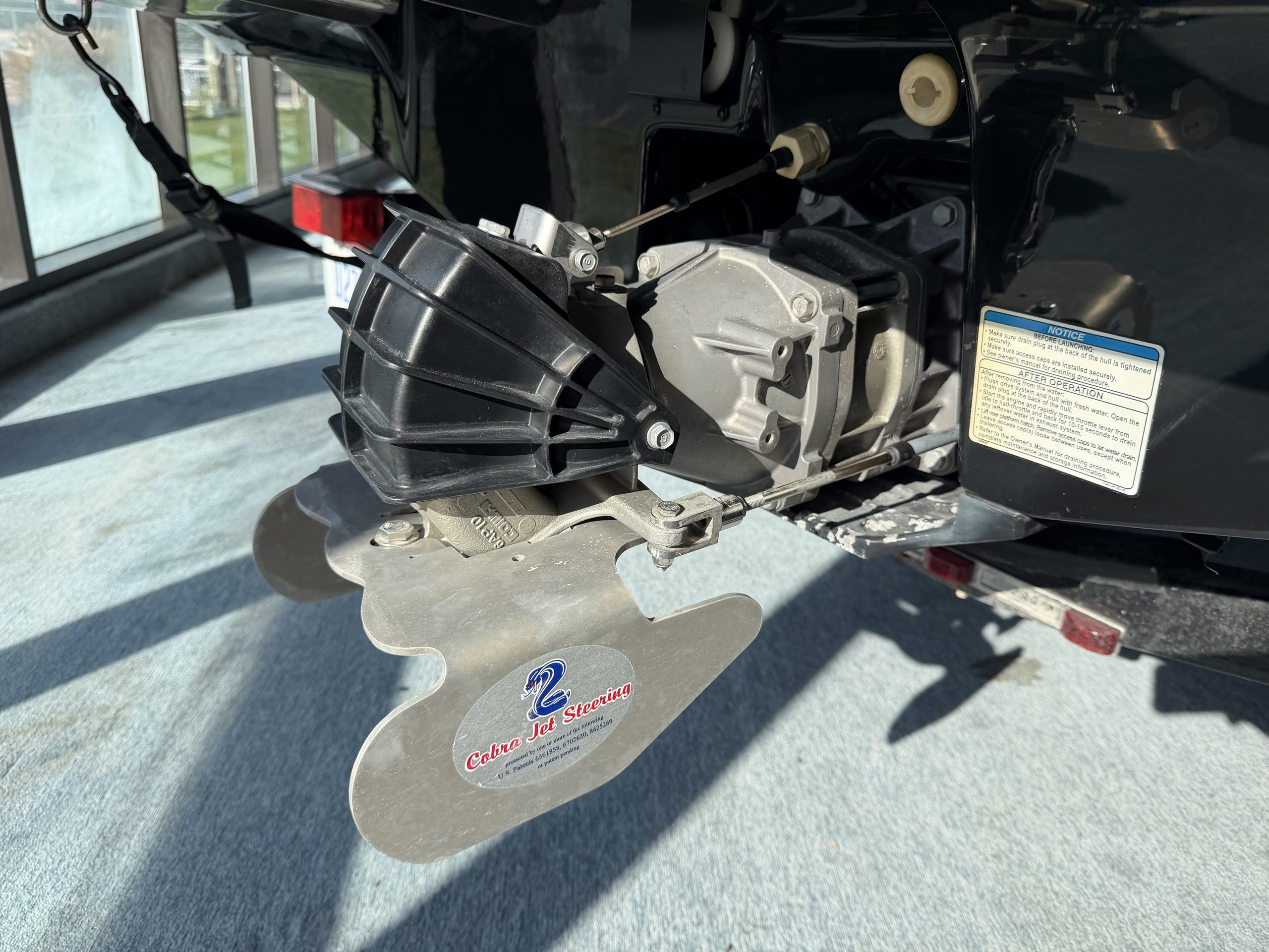 Close-up of Yamaha Jet SX192 boat engine with propeller and warning label.