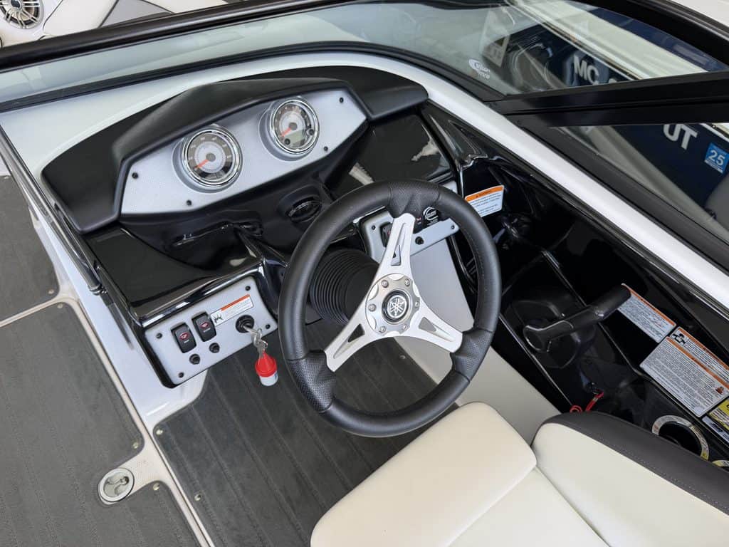 Close-up of Yamaha Jet SX192 boat dashboard and steering wheel.