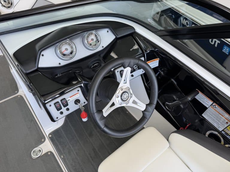 Close-up of Yamaha Jet SX192 boat dashboard and steering wheel.