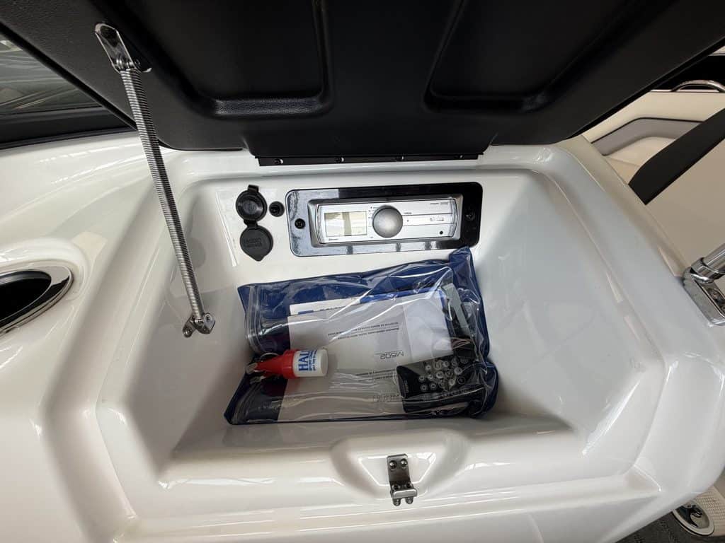 Storage compartment of Yamaha Jet SX192 with safety kit inside.