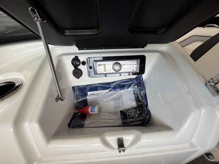 Storage compartment of Yamaha Jet SX192 with safety kit inside.