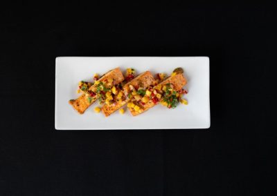 Delicious spring rolls filled with fresh vegetables on a white plate.