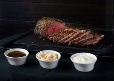 Juicy, perfectly cooked steak sliced with three dipping sauces.