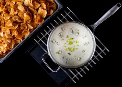Cooking scene with cereal and milk on a stovetop.