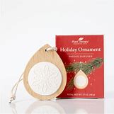 Decorative holiday ornament passive diffuser with essential oils for aromatherapy.