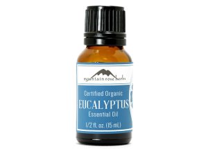 Certified organic eucalyptus essential oil in a small amber bottle.