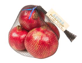 Fresh organic pomegranates in a mesh bag at Healthy Roots.