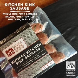 Smoked Kitchen Sink Sausage with bacon, pork, and herbs in clear packaging.