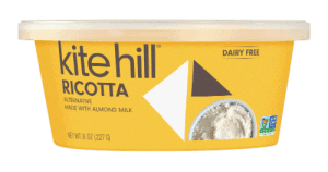 Kite Hill Ricotta cheese in a yellow container, dairy-free, almond milk-based.