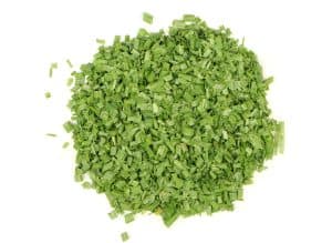 Close-up of chopped fresh chive rings for culinary use.
