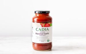 Cadia Organic Roasted Garlic Pasta Sauce jar on white background.