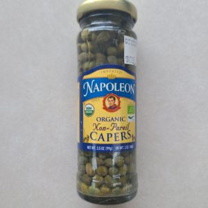 Organic non-pareil capers in a glass jar for healthy cooking.