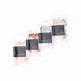 Assorted botanical bath salts in black containers on a white background.