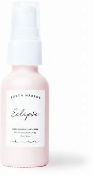 Earth Harbor Eclipse mineral sunscreen in a pink bottle with white pump.