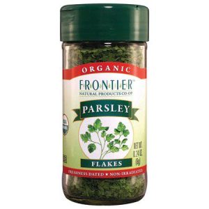 Organic parsley flakes in a clear jar with green lid for fresh flavor.