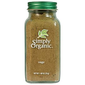 Organic ground sage leaf in glass jar for cooking and seasoning.