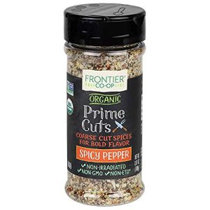 Organic Prime Cut Spicy Pepper in clear spice jar with black lid.