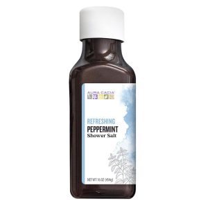 Peppermint shower salt bottle for refreshing bath experience.