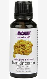 NOW Frankincense essential oil bottle with label and black cap.