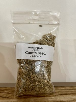 Organic cumin seed in clear bag for cooking and health benefits.