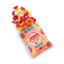 Vegan strawberry peach gummies in colorful packaging from Healthy Roots.