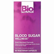Blood Sugar Wellness supplement bottle with purple label and capsules.