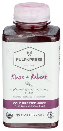 Cold pressed juice with apple, beet, grapefruit, lemon, ginger in a clear bottle.