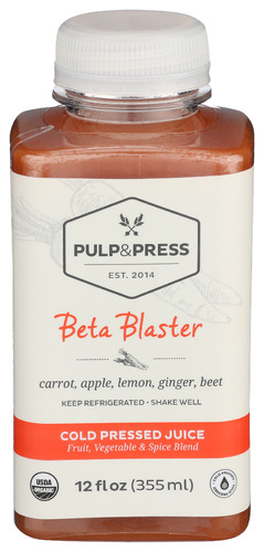 Cold pressed Beta Blaster juice with carrot, apple, lemon, ginger, and beet.