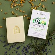 Healthy Roots Refresh Lotion Bar with herbal ingredients and packaging.