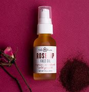 Healthy Roots Rosehip Face Oil in a glass bottle with pump dispenser.