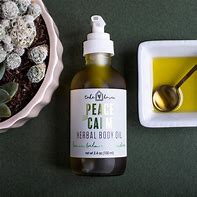 Peace and Calm herbal body oil in a spray bottle for relaxation.