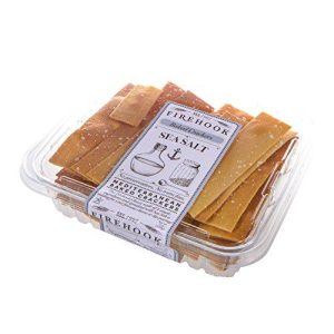 Baked sea salt crackers in clear plastic container with label.