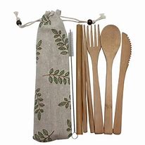 Eco-friendly bamboo cutlery set with cotton storage bag for sustainable dining.