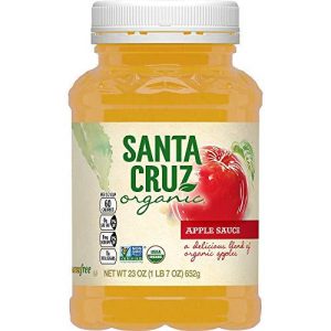 Organic apple sauce jar with red apple image and green label.