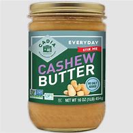 Healthy Roots cashew butter jar with label highlighting natural ingredients.