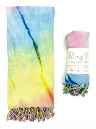 Colorful pastel multi beach towel with fringed edges for summer and beach use.