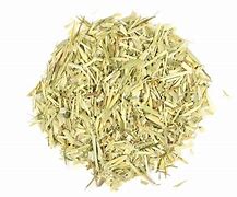 Oatstraw herb in a pile for herbal tea and wellness use.