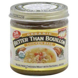 Organic chicken base in jar for cooking and flavoring dishes.