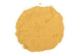 Close-up of rosehip powder in a scoop, highlighting natural health benefits.