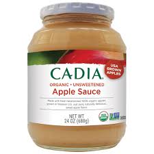 Jar of Cadia unsweetened applesauce with red apple image on label.