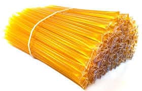 Pack of yellow honey sticks for natural sweetening and healthy snacks.