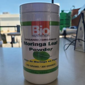 Organic Moringa Leaf Powder container for health and nutrition.