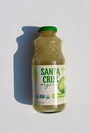 Healthy Roots Santa Cruz Lime juice in glass bottle with green cap.