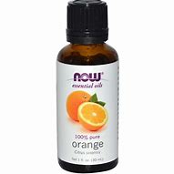 Pure orange essential oil in a small amber bottle for aromatherapy and skincare.