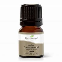 Indian Sandalwood essential oil bottle for aromatherapy and skincare.