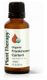 Small amber glass bottle of Organic Frankincense essential oil with dropper cap.